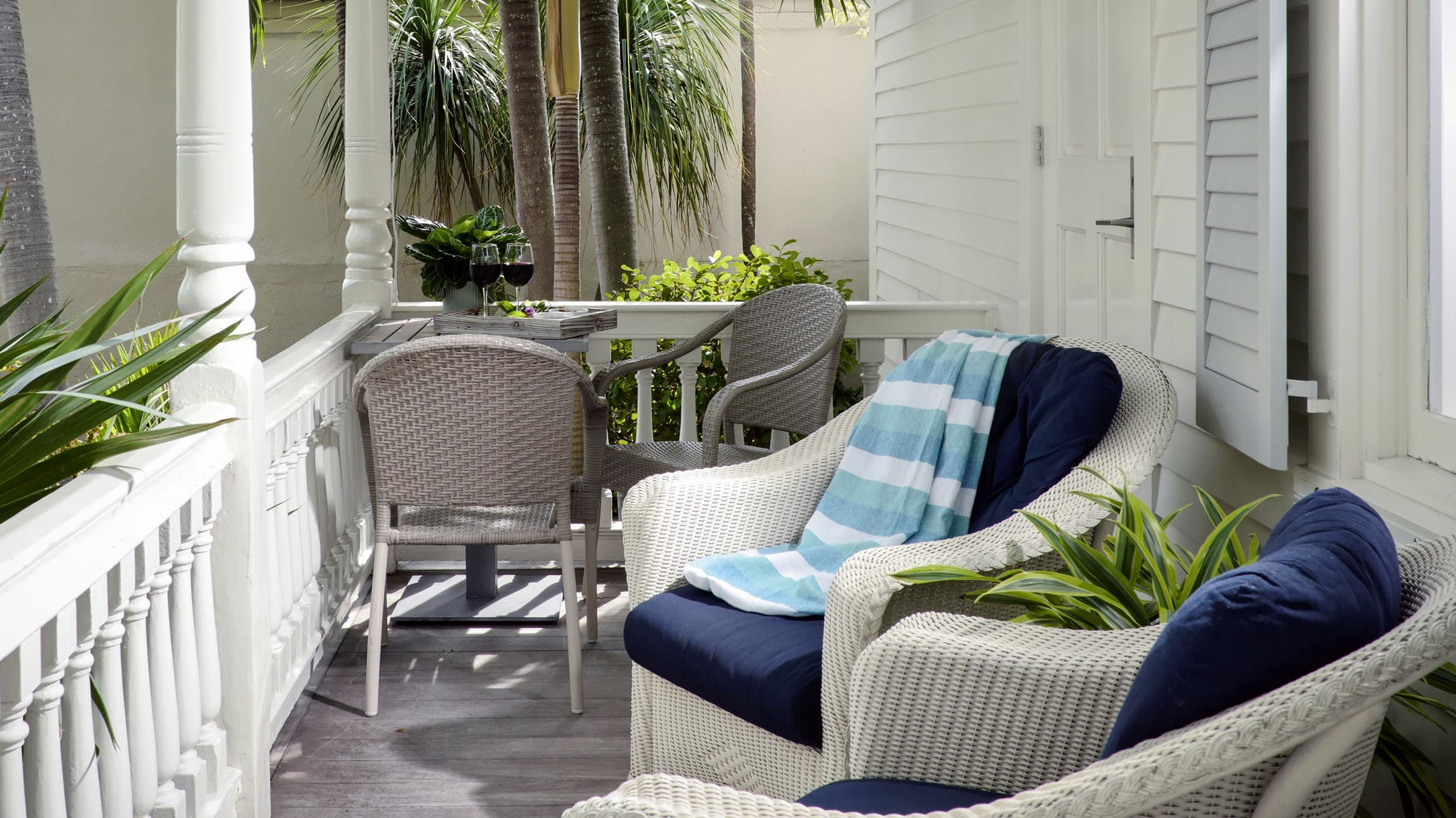 414 Bahama Suite PORCH with a small table and 4 chairs