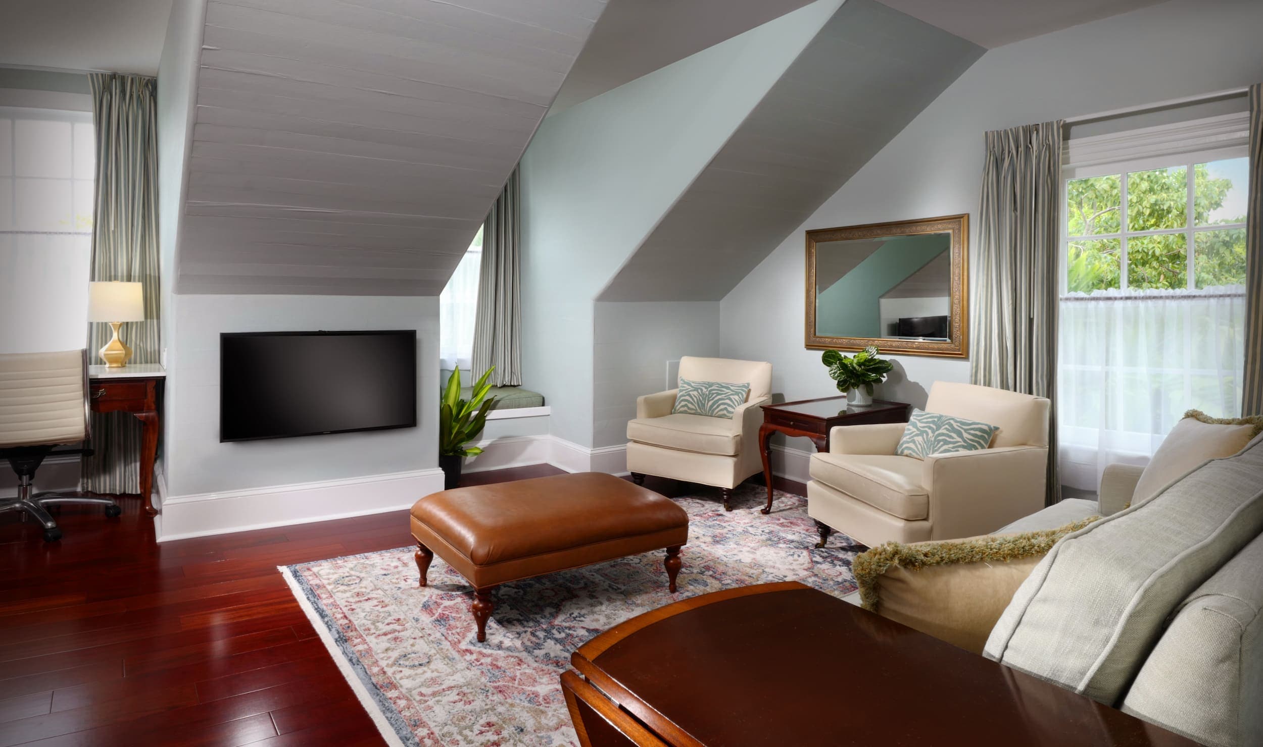 James Haskins suite with a tv, desk, and plenty of hosting space