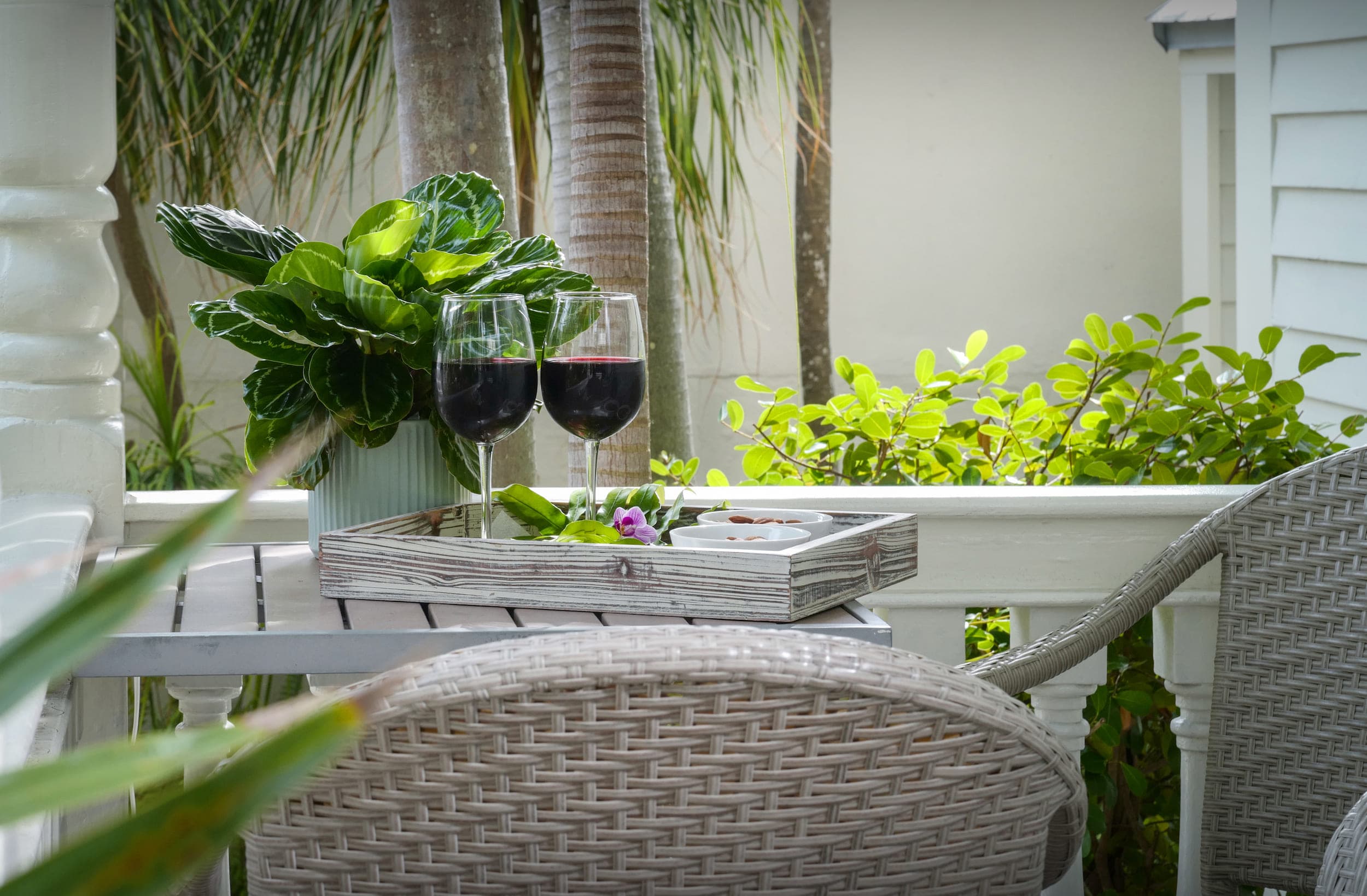 Wine and snacks on a balcony table at Marquesa