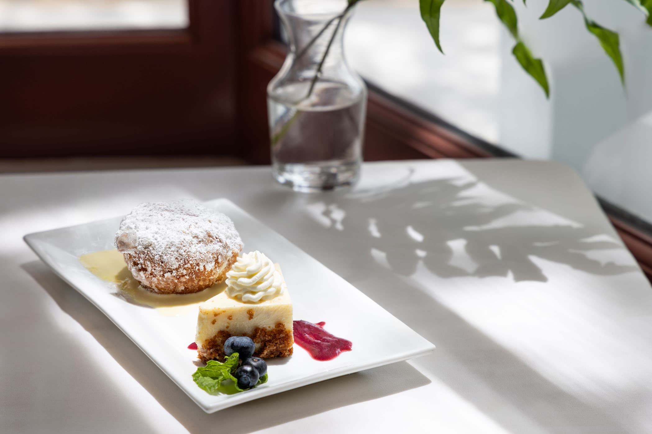 A pastry dish with carrot cake and blueberries